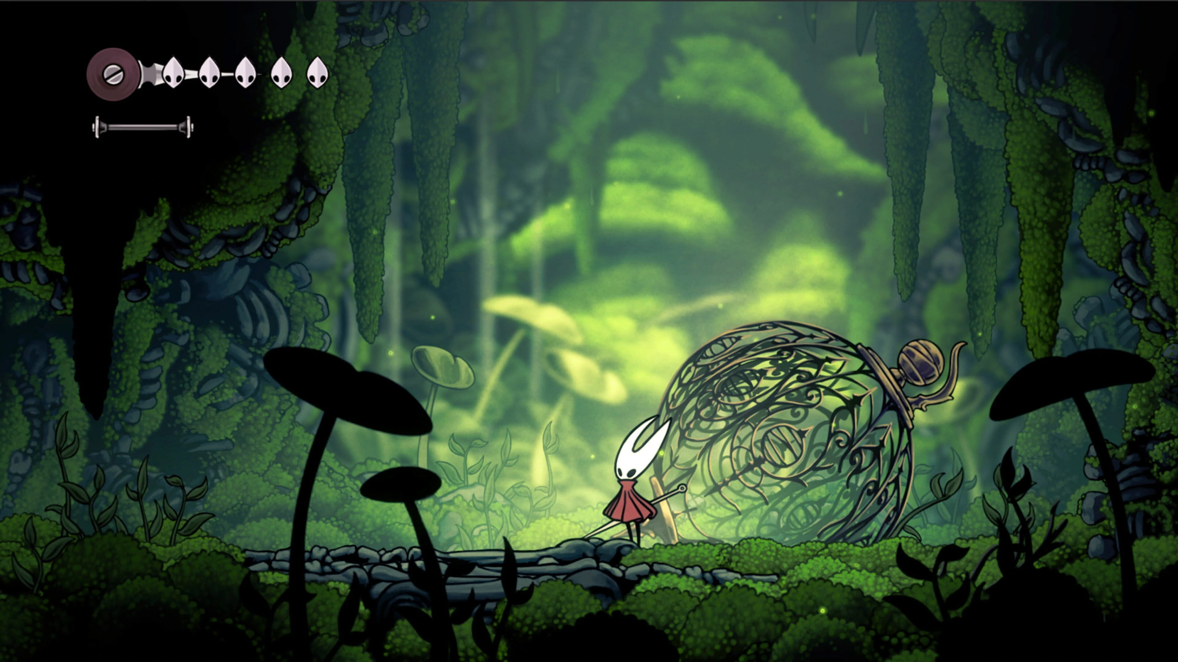 Hornet in combat, deflecting projectiles in a cave