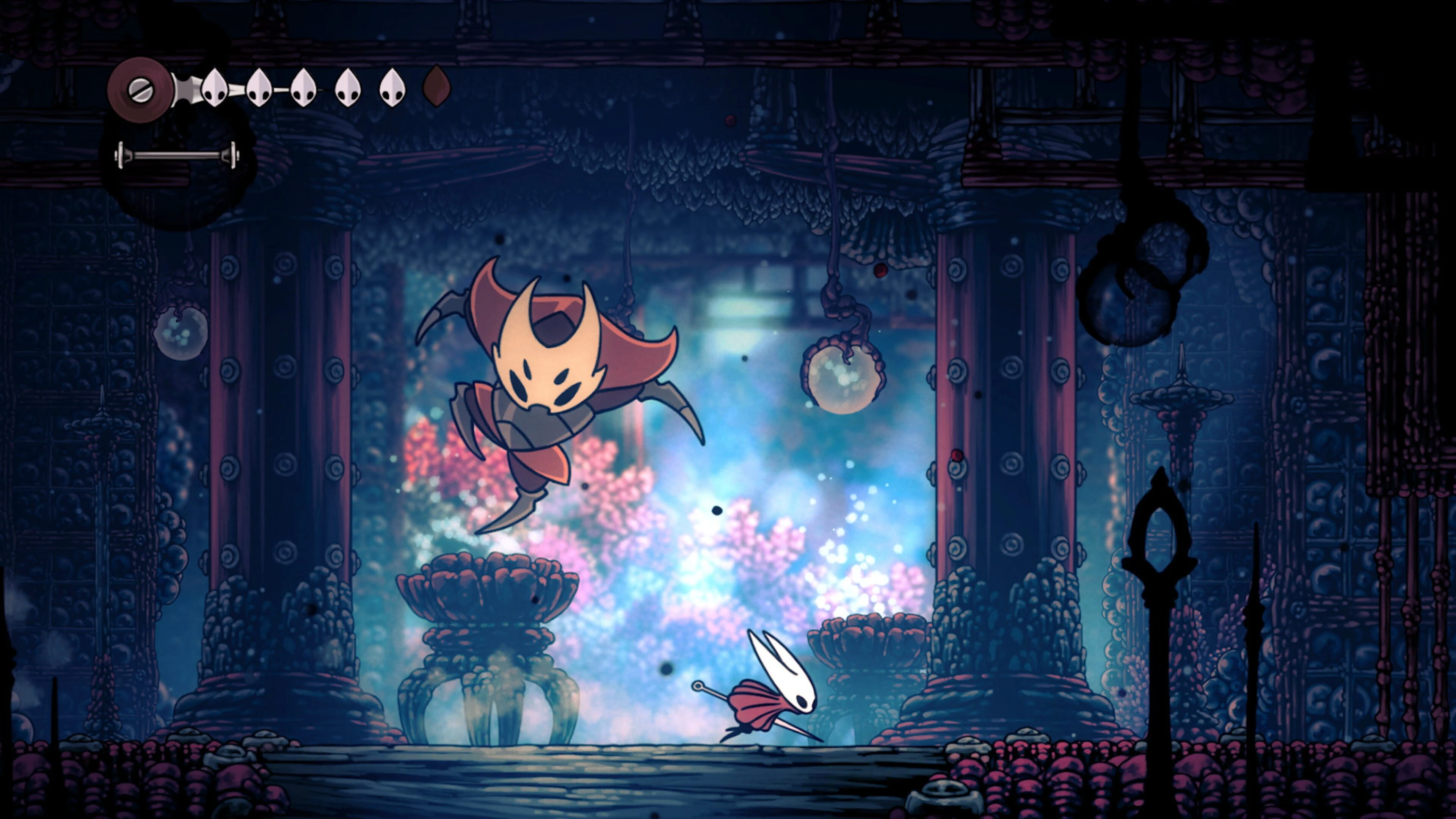 Hornet fighting a boss in a colorful, ornate room